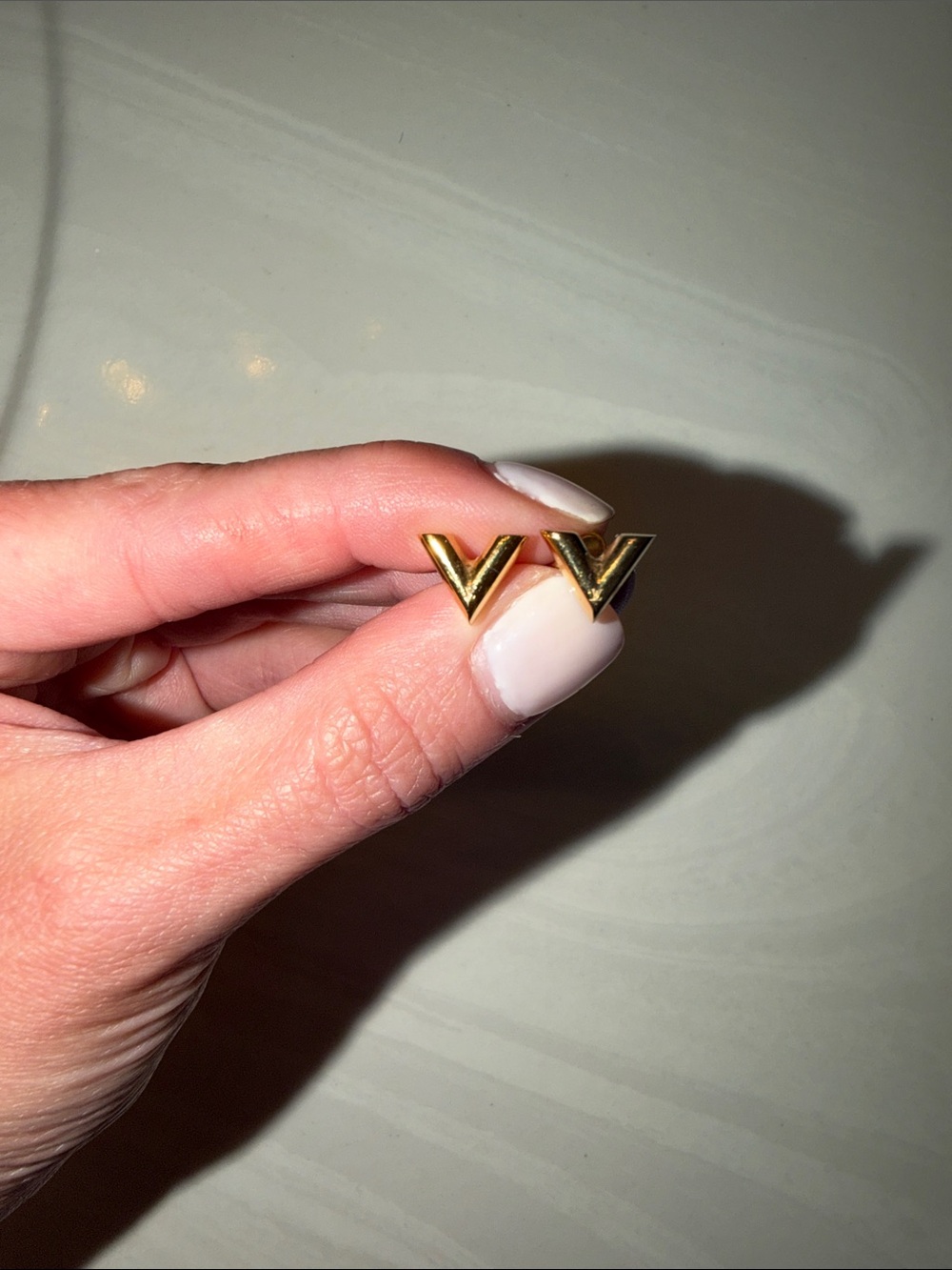 Gold V. Louis Vuitton Stud Earrings